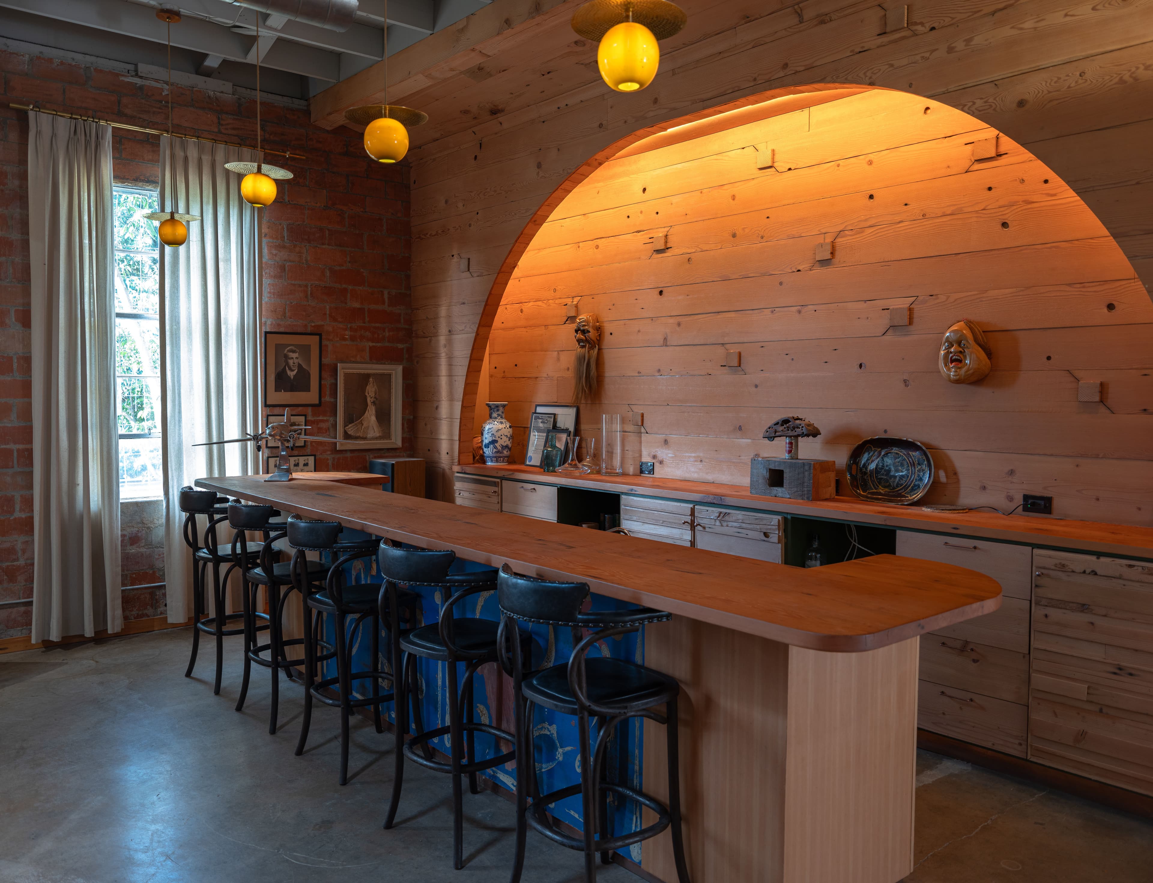 A wooden bar and barstools